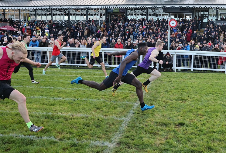 Scott Tindle winning the New Year Sprint from Gkontouin Imante with Euan Urquart (nearest camera) third, Greg Kelly (yellow bib) fourth, Murray Blair (furthest from camera) sixth and Gordon Armstrong (green bib) seventh.