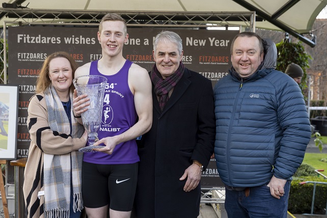 New Year Sprint winner Scott Tindle with family and coach Bruce Scott (Bruce is on Scott's left).